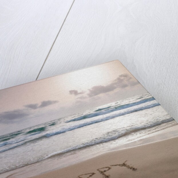 Sand writing on beach by Assaf Frank